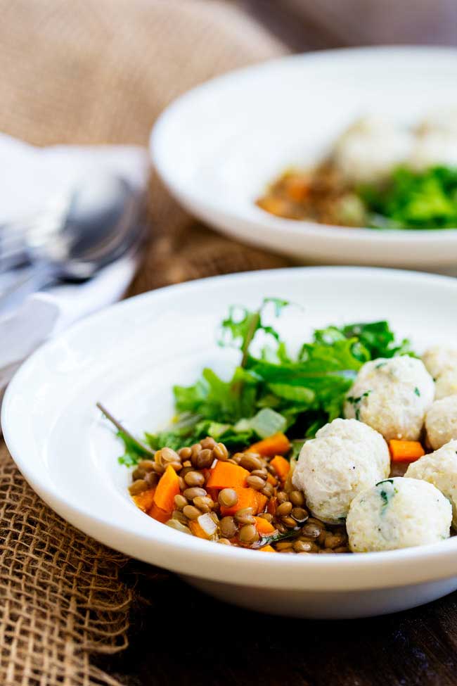 This Lentil Bowl with kale and chicken meatballs is the perfect mix of comfort food and healthy lunch. Hearty and warming without being heavy or stodgy but light enough for a warm day. It really is the dish for all seasons!