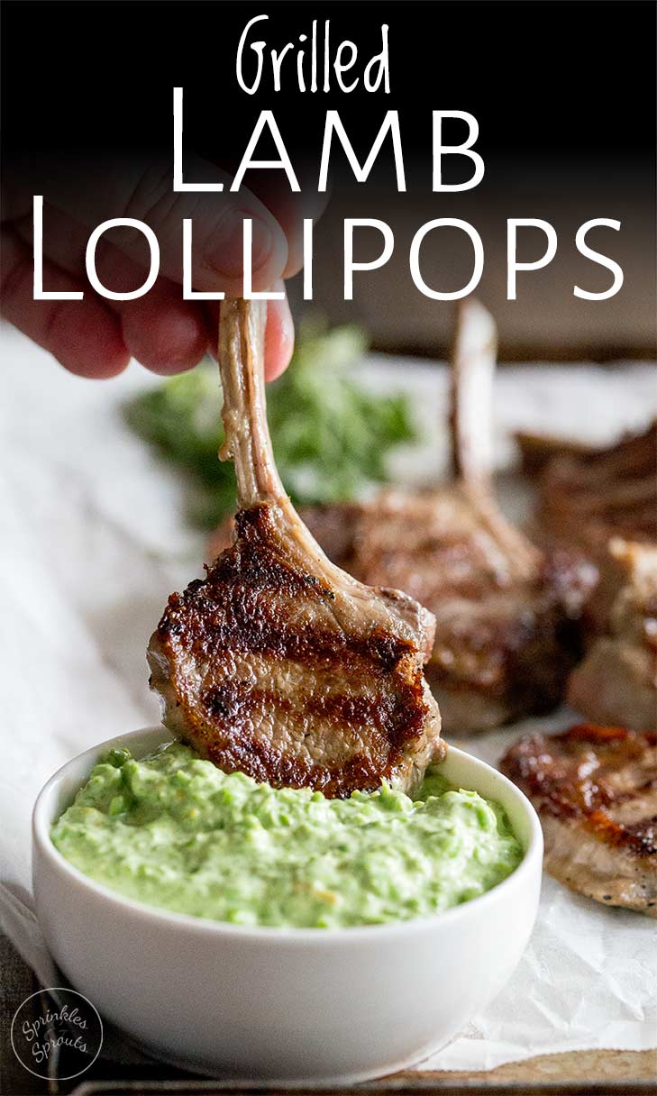 a lamb chop being dipped into a bowl of pea dip