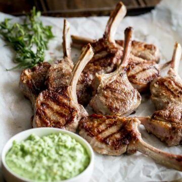 These Grilled Lamb Lollipops makes a great dish to feed the whole family. Deliciously juicy lamb chops, seared to perfection served with a sweet spring pea and lemon dip.