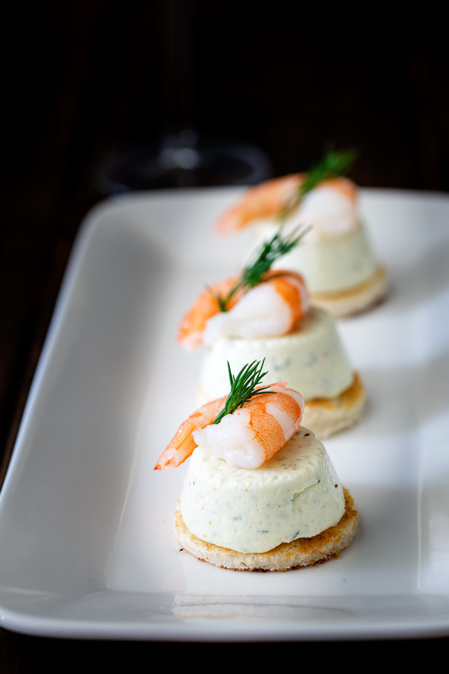 These Cucumber Mousse And Dill Shrimp Bites are sublime. The subtle and refreshing taste of cucumber combined in a soft heavenly mousse, sat on top of a crispy toast circle and topped with a succulent shrimp and the freshness of dill.