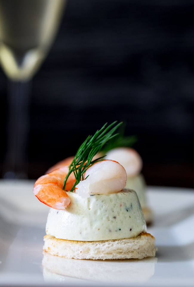 These Cucumber Mousse And Dill Shrimp Bites are sublime. The subtle and refreshing taste of cucumber combined in a soft heavenly mousse, sat on top of a crispy toast circle and topped with a succulent shrimp and the freshness of dill.