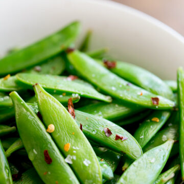 Crisp, sweet sugar snap peas, sautéed to a tender crisp perfection and then sprinkled with chilli flakes and sea salt. A healthy 5 minute side dish!