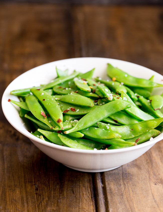 Crisp, sweet sugar snap peas, sautéed to a tender crisp perfection and then sprinkled with chilli flakes and sea salt. A healthy 5 minute side dish!