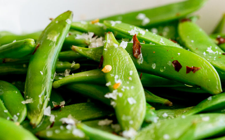 Crisp, sweet sugar snap peas, sautéed to a tender crisp perfection and then sprinkled with chilli flakes and sea salt. A healthy 5 minute side dish!