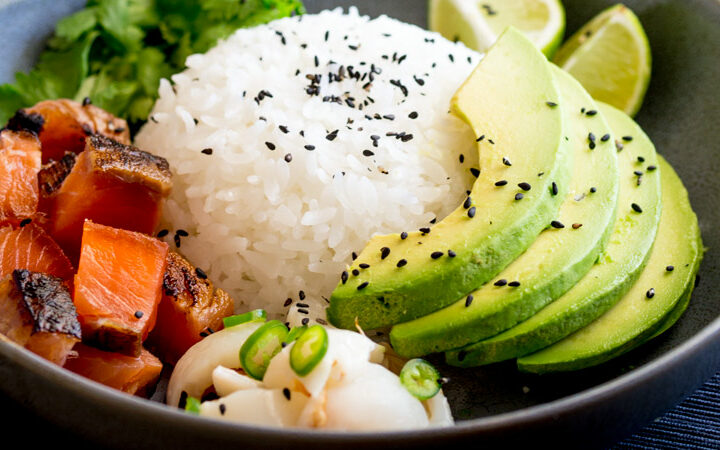 Sweet salty Salmon, Creamy Avocado and a Lychee Salsa that packs a flavour punch! All sitting on top of seasoned sticky rice. Sushi bowls are fun to put together and are a great way to get the flavours of sushi without having to roll or press the rice!