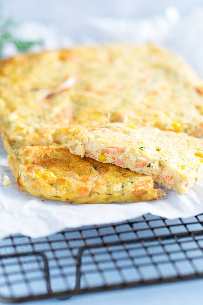 This Smoked Salmon Frittata is oven baked in a sheet pan, making it perfect for feeding a group. Enjoy it at any time of day. Personally I like it for brunch with a glass of bucks fizz.