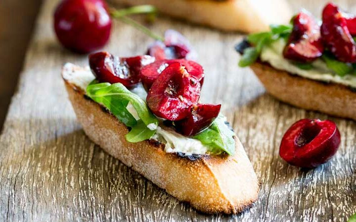 Creamy, salty blue cheese, peppery rocket and sweet juicy cherries. These Blue Cheese Bruschetta with Cherry Salsa are a delicious snack or appetiser. When cherries are at their ripest, these bruschetta are the perfect thing to make. The sweet fruity cherry is the perfect partner to the rich blue cheese. Cheese and fruit are a match made in heaven!