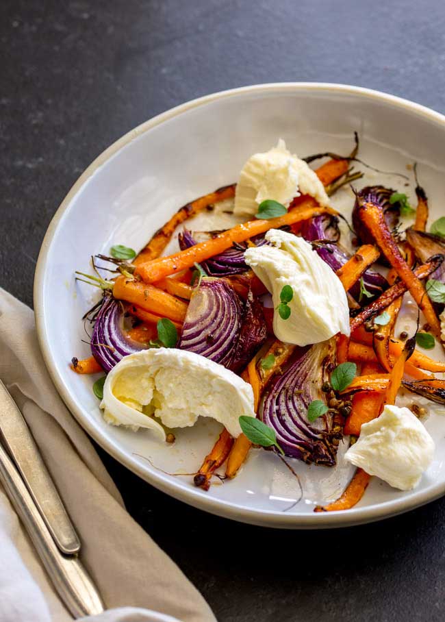 Sweet sticky caramelised vegetables, a spiced vinaigrette and soft smooth milky mozzarella. This Spiced Carrot, Red Onion and Mozzarella Salad is the salad for people who don't like salad. The carrots are nutty and sweet, the onion is sticky and fragrant, the dressing perks everything up and then then mozzarella calms and cools. The perfect salad for so many occasions. From Sprinkles and Sprouts.