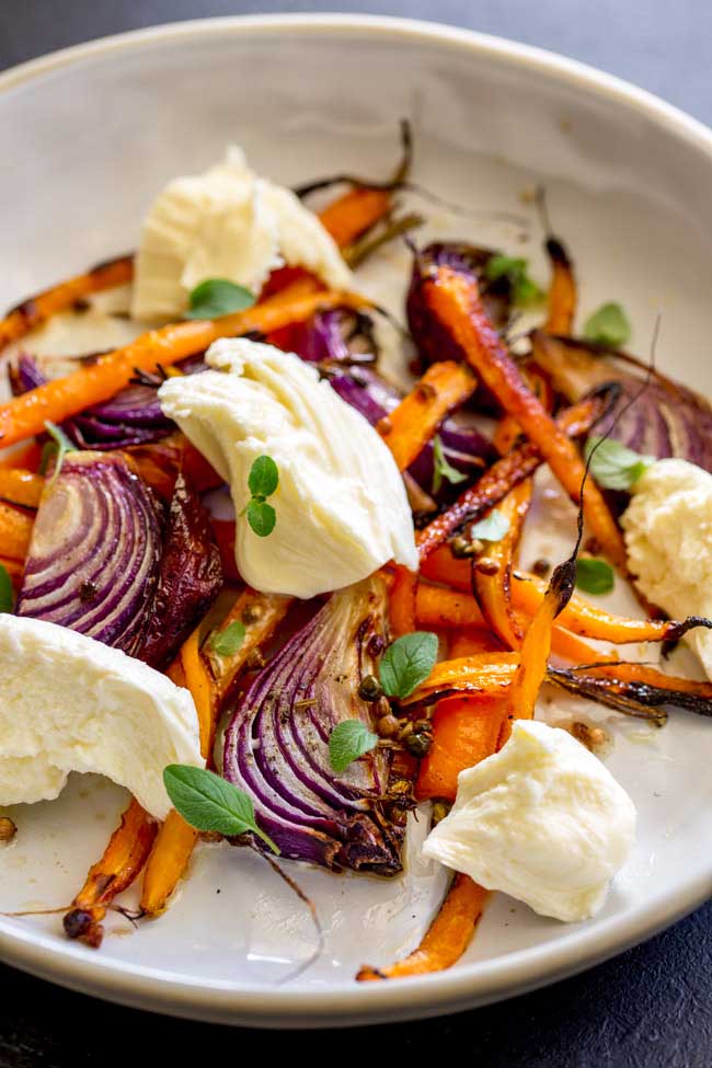 Sweet sticky caramelised vegetables, a spiced vinaigrette and soft smooth milky mozzarella. This Spiced Carrot, Red Onion and Mozzarella Salad is the salad for people who don't like salad. The carrots are nutty and sweet, the onion is sticky and fragrant, the dressing perks everything up and then then mozzarella calms and cools. The perfect salad for so many occasions. From Sprinkles and Sprouts.