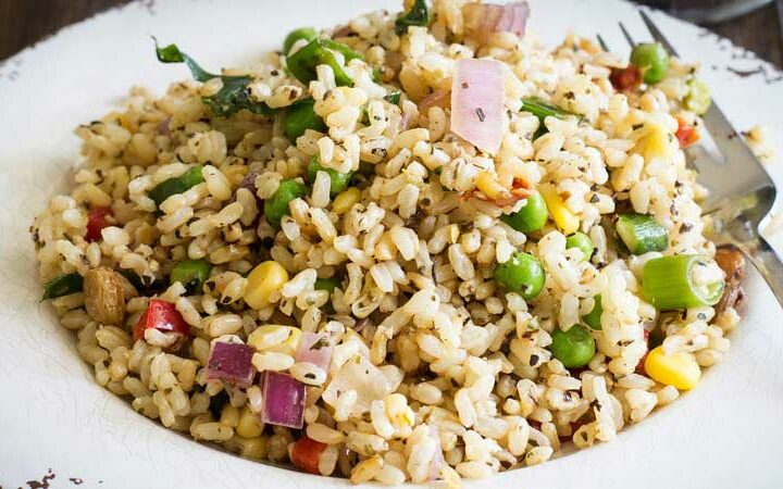 Nutty brown rice, sweet crunch vegetables and flavour packed herbs. This brown rice salad is not your average salad. It is nutritious and delicious. From Sprinkles and Sprouts