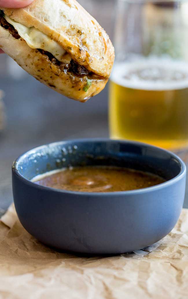 These Pressure Cooker Italian Beef Subs are the perfect midweek meal for the whole family. Juicy succulent shredded beef, stuffed inside soft rolls topped with provolone and dunked into a flavour packed gravy/sauce. Everyone who tries these loves these and they are so simple to make. Recipe includes instructions for Instant Pot and Stove top pressure cookers.