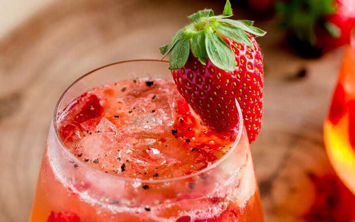 Sweet strawberries, fragrant gin and fiery pepper. This Strawberry and Black Pepper Gin and Tonic is a different and delicious way to enjoy your Gin and Tonic. From Sprinkles and Sprouts.