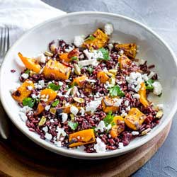 This Black Rice, Goats Cheese and Maple Roasted Pumpkin Fall Salad has it all!!! Nutty sweet black rice, sweet smoky pumpkin, fresh tangy goats cheese, sweet cranberries and crunchy pistachios. Delicious as a main or a side, this is the perfect dish for fall. From Sprinkles and Sprouts