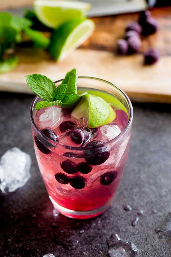 Slight sweet blueberries with tart lime and the zing of mint. This Blueberry, Lime and Mint muddled gin and tonic is the perfect balance of flavours. From Sprinkles and Sprouts