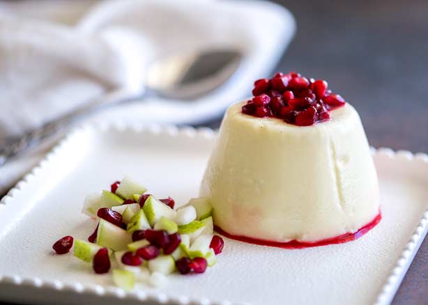 This Pear and Pomegranate Panna Cotta is rich and creamy with a deliciously fruity festive edge. The colours pop on the plate making this make ahead dessert is perfect for entertaining. Recipe from Sprinkles and Sprouts | Delicious food for Easy Entertaining