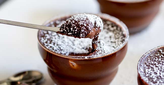 Close up on the spoonful of rich chocolate mousse.
