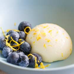 Lemon Panna Cotta | A deliciously fresh prepare ahead dessert that is sure to wow your guests. The refreshing lemon cream is just set so the panna cotta has a wonderful wobble. Served with fresh blueberries this Lemon Panna Cotta is a wonderful easy yet impressive dessert. Recipe by Sprinkles and Sprouts | Delicious Food for Easy Entertaining
