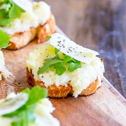 This Parsnip and Parmesan Bruschetta with Arugula takes the earthy underused parsnip and turns it into something elegant and totally delicious. Perfect as a party nibble or an appetizer before a big holiday meal; this bruschetta is delicious and easy to prepare in advance.