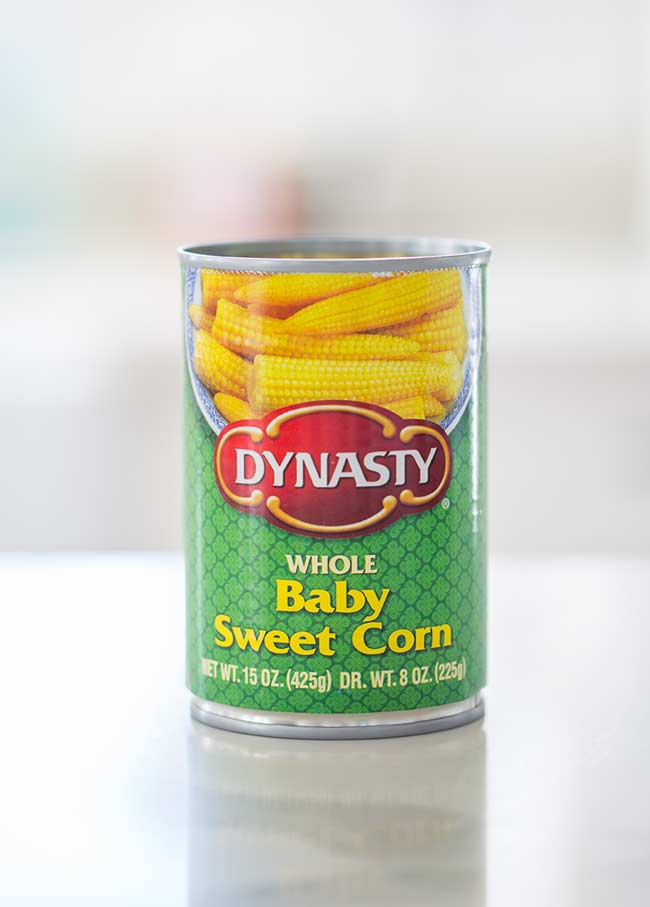Green can of baby sweetcorn.