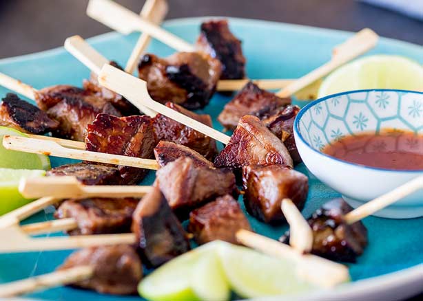Close up on the charr and burnished copper colour of these Mongolian lamb skewers