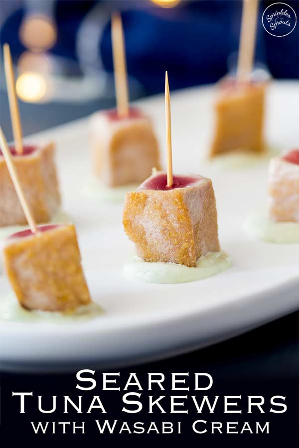 Pin image, showing seared tuna skewers on a white platter with text at the bottom of the picture