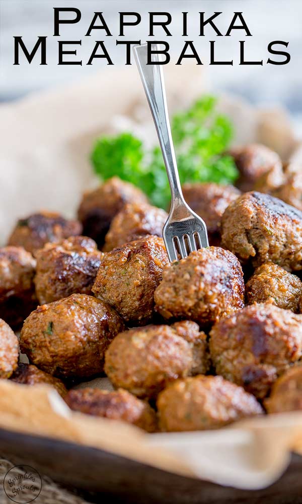 pinterest image showing a beef meatball on a fork with text at the top of the image