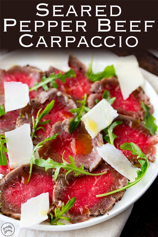 Pinterest image showing a plate of seared beef carpaccio wit text at the top of the image