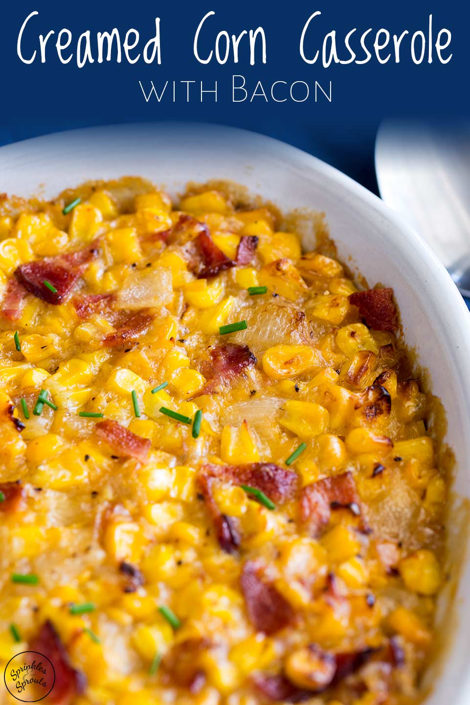 clos cup of the crust of the creamed corn casserole with writing at the top