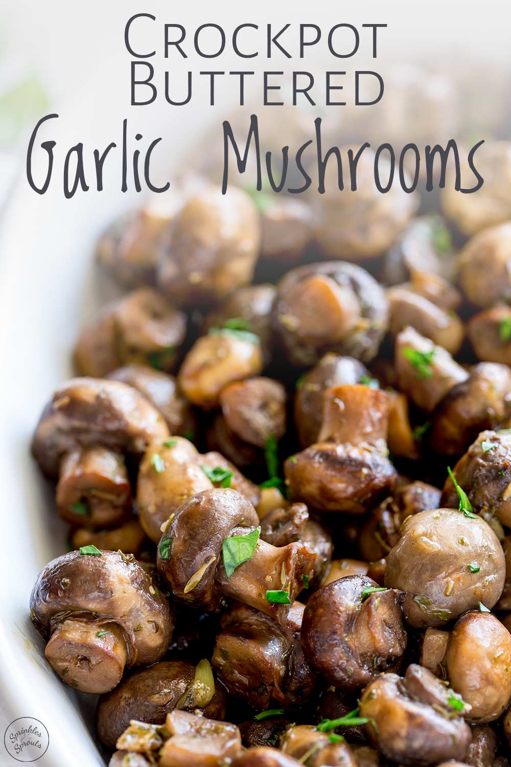 close up on the garlic mushrooms in the crockpot with text at the top