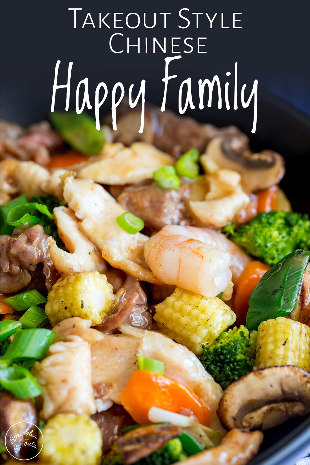 Pinterest image - close up on the chicken, beef, shrimp and vegetable in a black wok with text at the top
