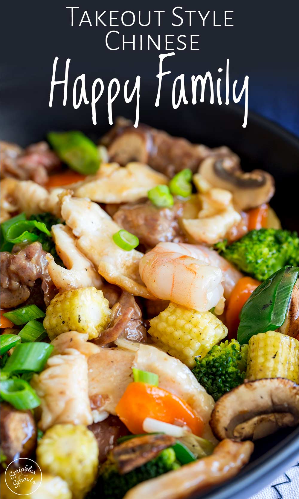 Pinterest image - chicken, beef, shrimp and vegetable in a black wok with text at the top