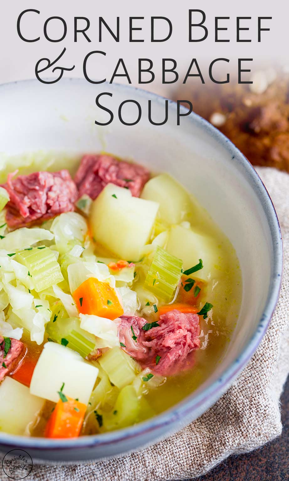 close up of the corned beef soup in a blue bowl with text at the top
