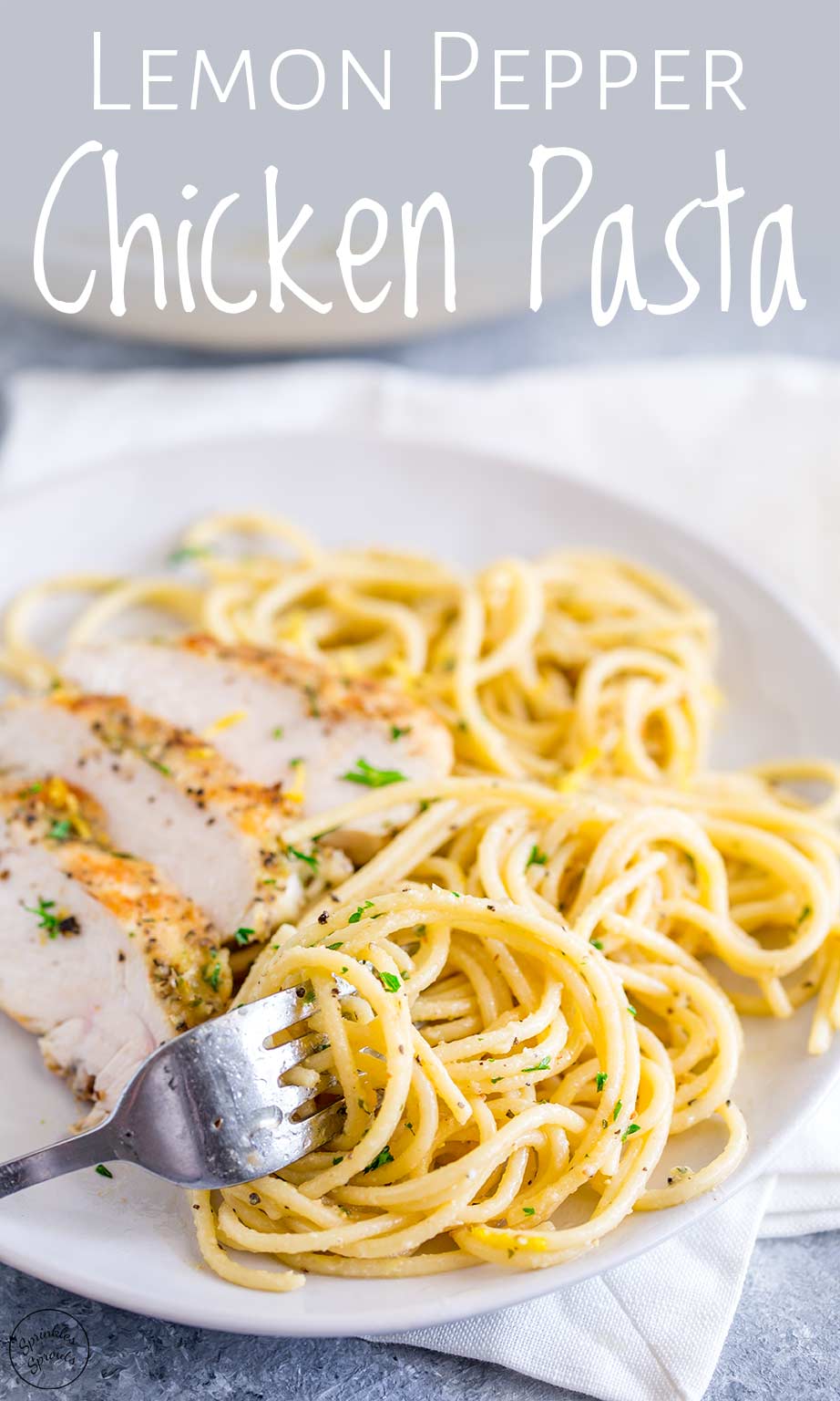 a fork swirling some lemon pepper chicken pasta off a white plate with text at the top