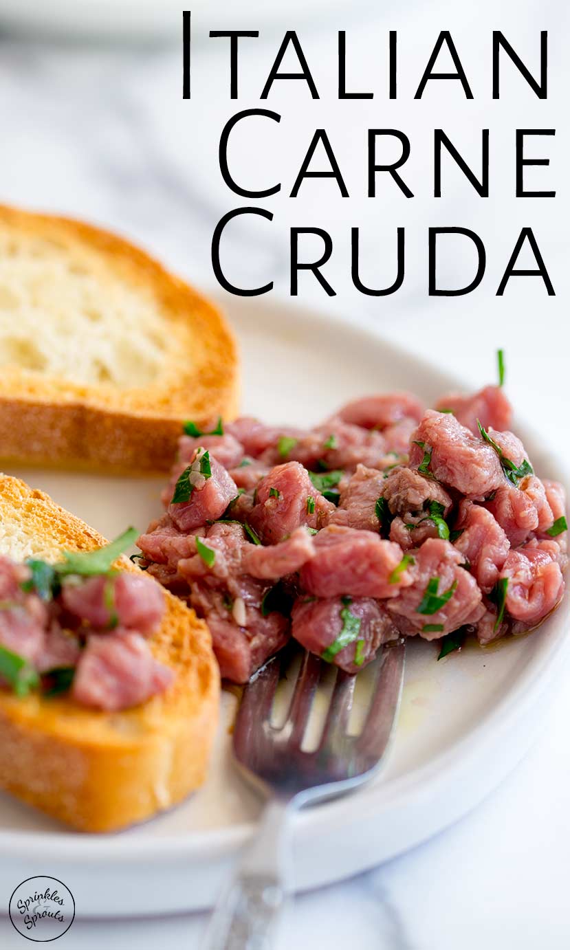 a white plate of carne cruda with text at the top
