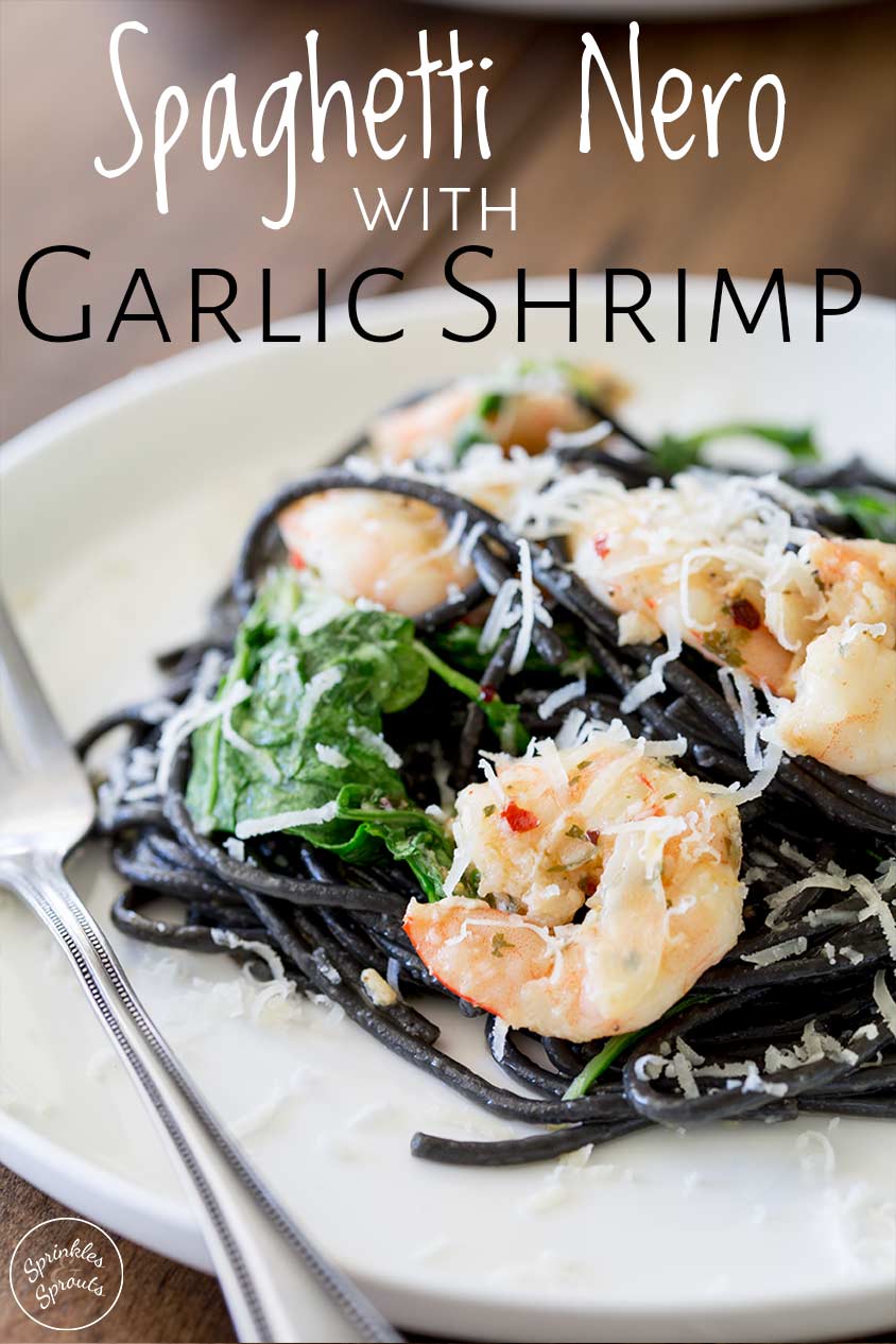 squid ink pasta and shrimp on a white plate with text at the top
