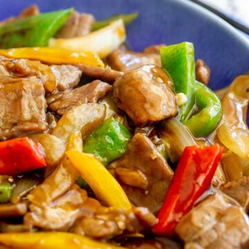 close up on strips of bell pepper with stir fried beef