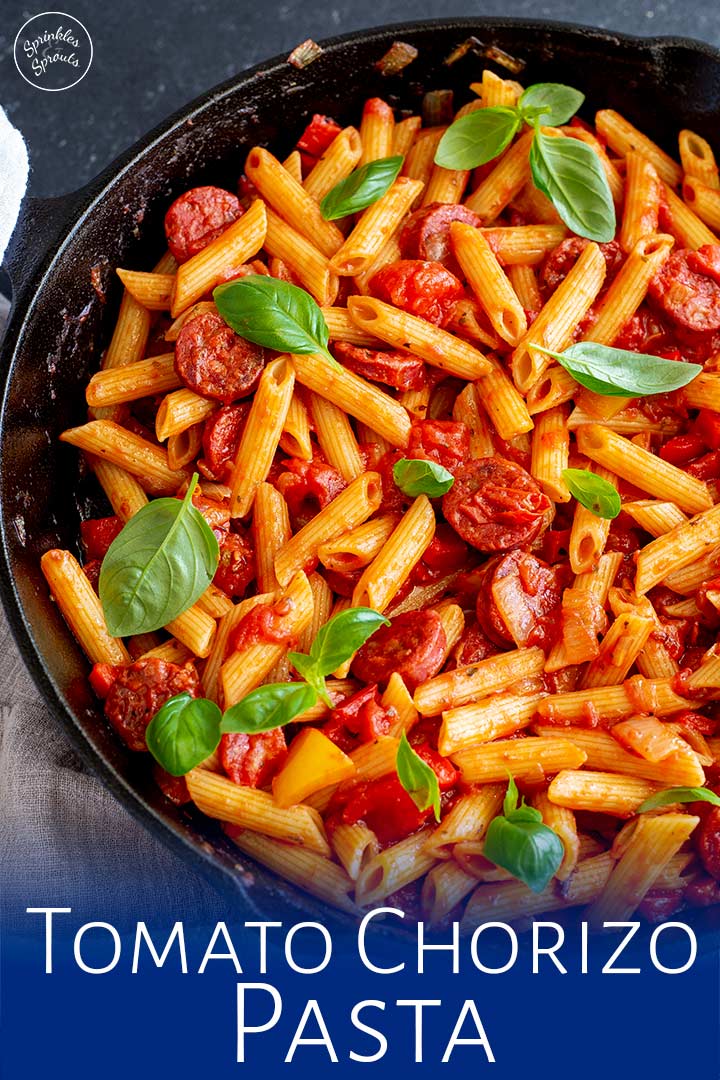 Tomato Chorizo Pasta in a cast iron skillet with text at the bottom