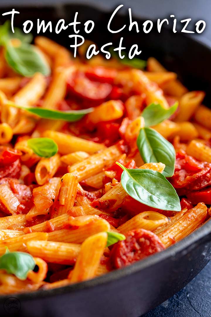 Tomato Chorizo Pasta in a cast iron skillet with text at the top