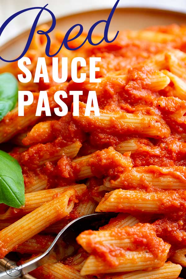 A Fork in a bowl of Red Sauce Pasta with text at the top