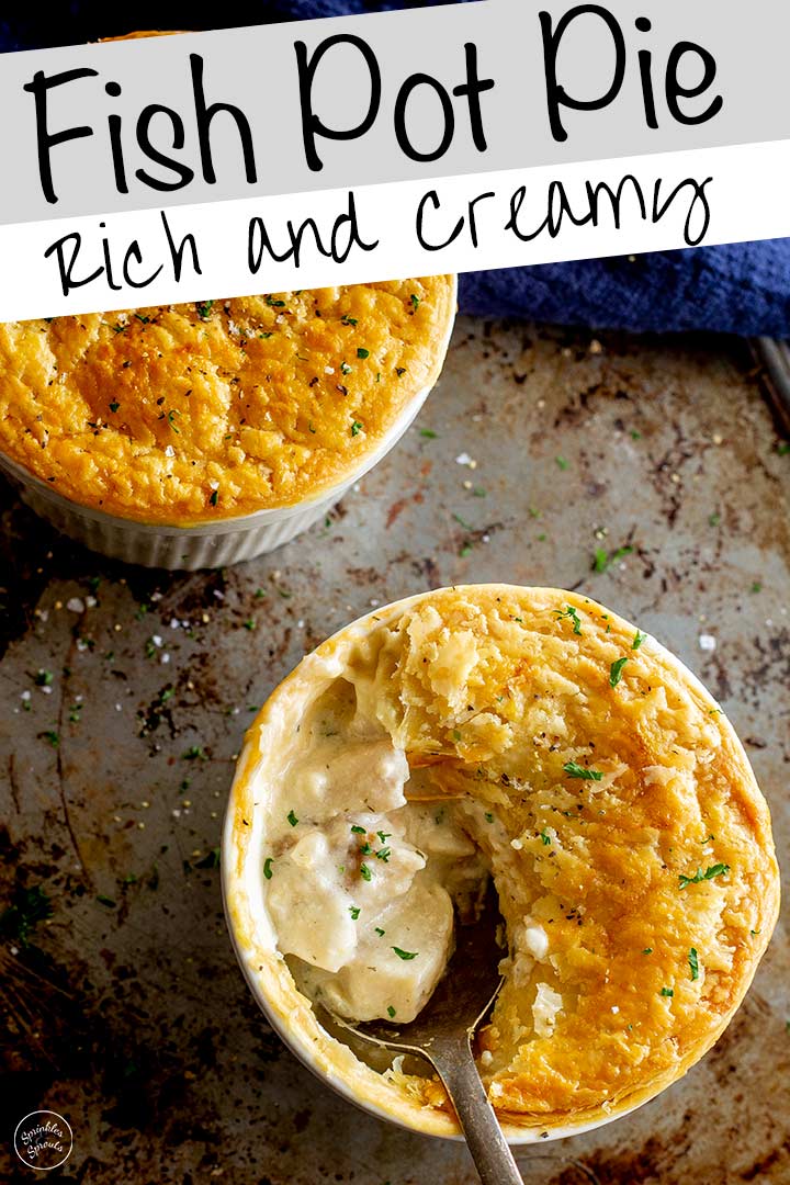 two pot pies on a metal tray, one with a spoon lifting out the fish filling with text at the top