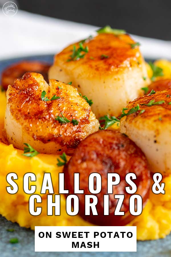 Close up on scallops and chorizo on sweet potato mash with text at the bottom