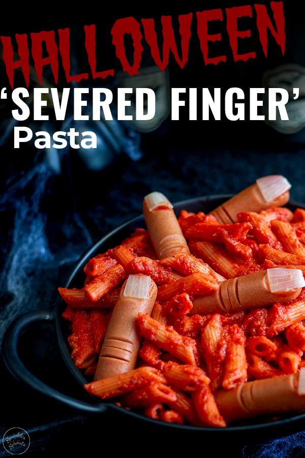 a black bowl of halloween pasta with 'severed fingers' with text at the top