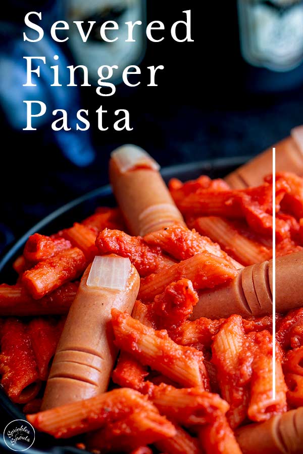 close up on the hotdog severed fingers in this halloween pasta with text at the top