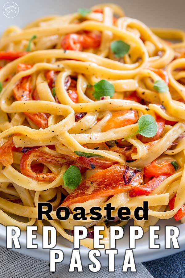 close up on roasted red pepper pasta with text at the bottom