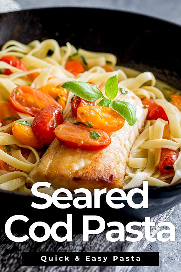cooked fillet of cod on a bed of pasta with text at the bottom