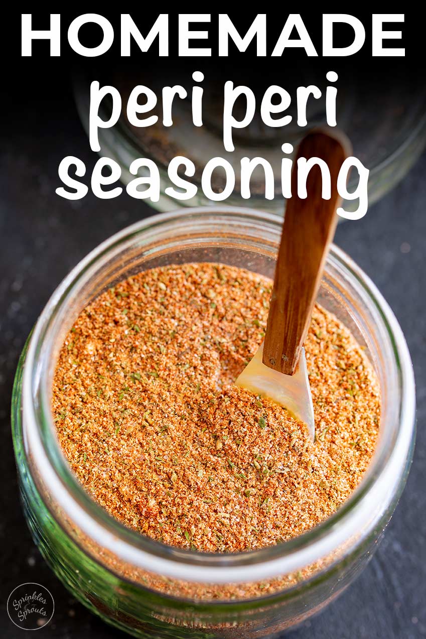 a glass jar of per peri seasoning in it with text at the top