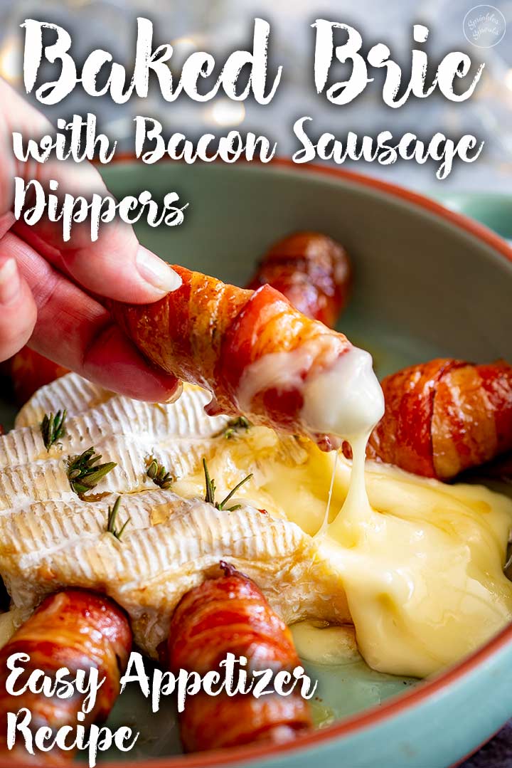 a hand dipping a bacon wrapped sausage into Baked Brie with text at the top and bottom