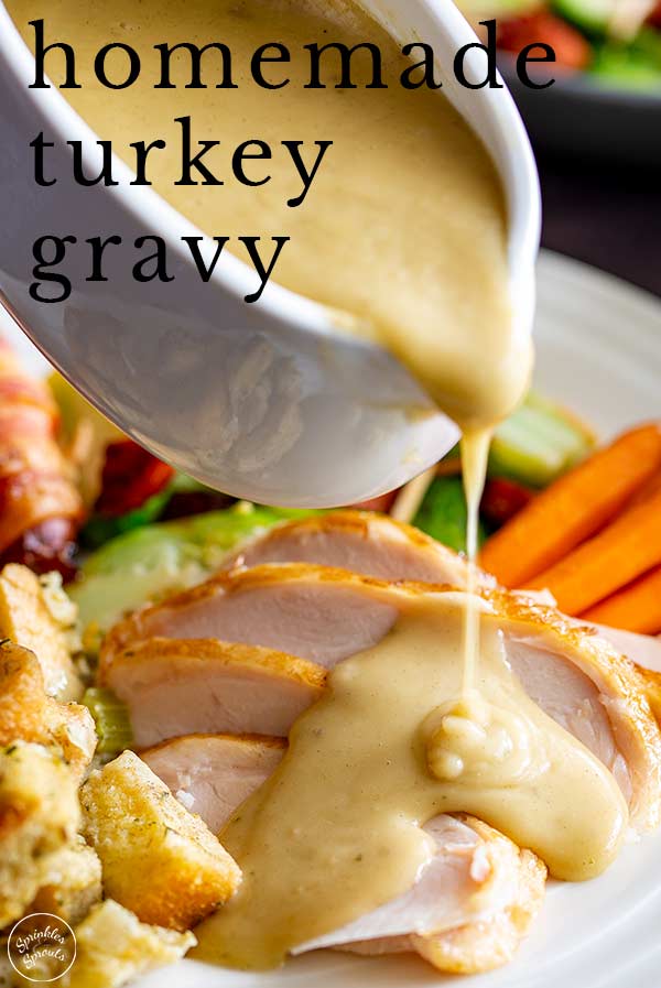 gravy being poured over a roast turkey dinner with text at the top