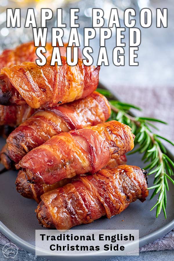 a grey oval plate piled with sausages wrapped in bacon with text at the top and bottom