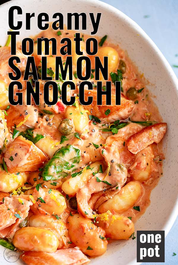 overhead close up of salmon gnocchi with text at the top and bottom